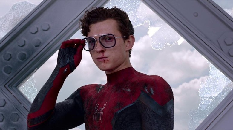 Peter holds his glasses