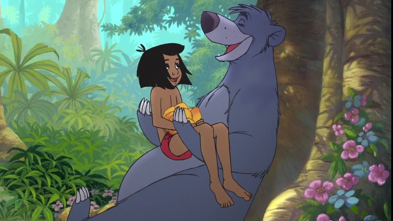 Baloo holds Mowgli