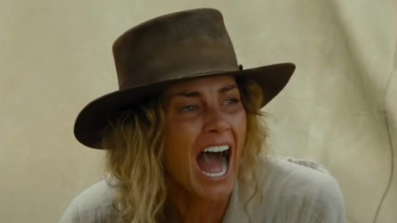 A blonde woman screaming and crying