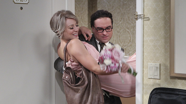 Leonard carrying Penny into room