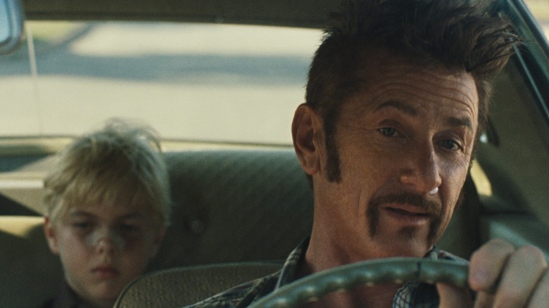 Sean Penn driving with child