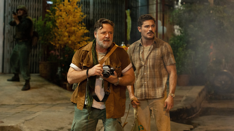 Russell Crowe and Zac Efron in a war zone