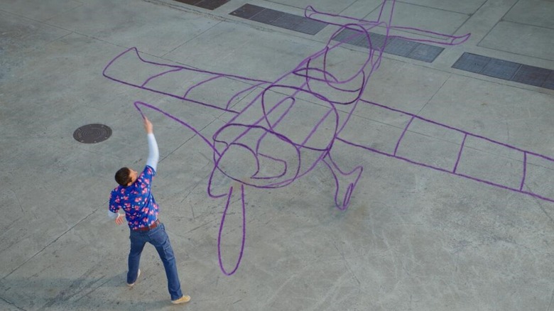 Harold uses his purple crayon to draw a prop plane