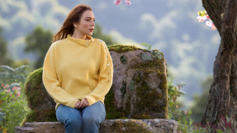 Maddie sitting on rock