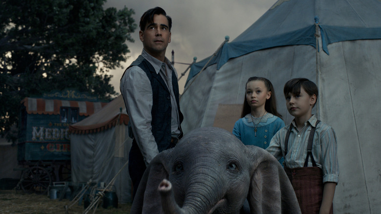 Colin Farrell stands with Dumbo