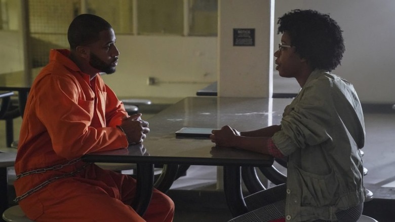 Dante and Kasey in a prison meeting room