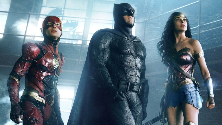 Flash, Batman, and Wonder Woman standing together