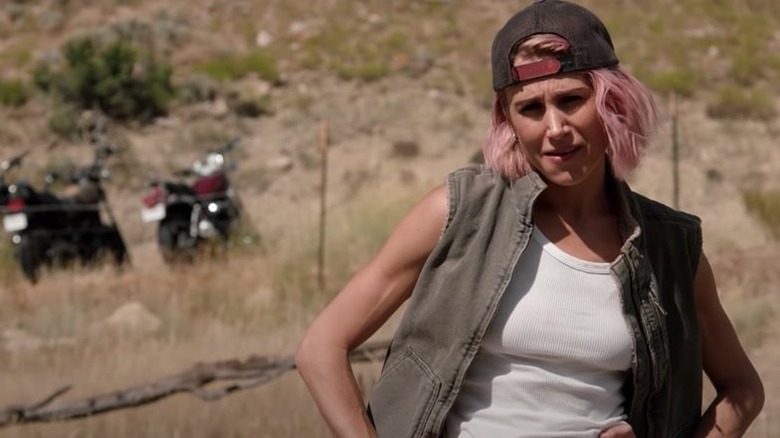 Teeter watches from a field near motorcycles on "Yellowstone"