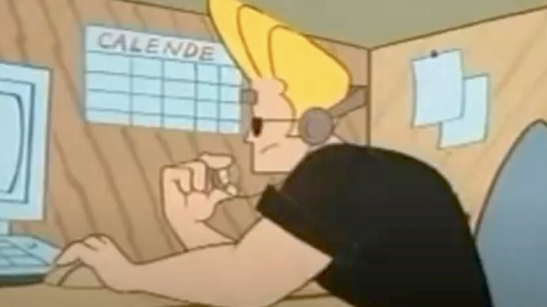 Johnny Bravo sitting at helpline desk