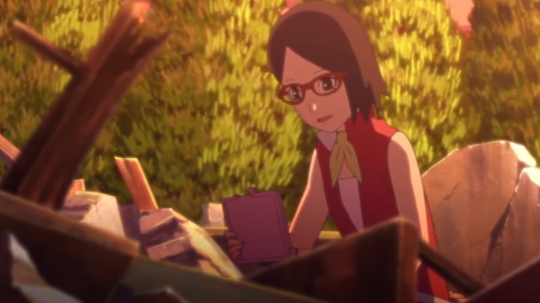 Sarada going through her destroyed home