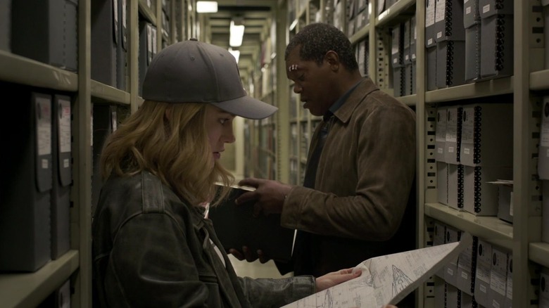 Nick Fury and Carol Danvers reading documents