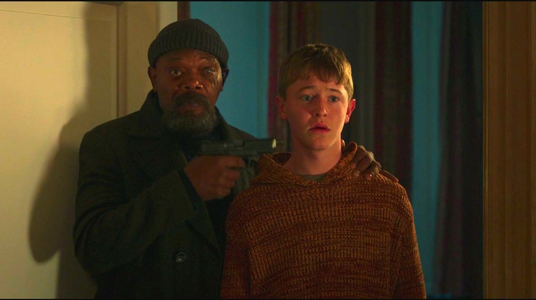 Nick Fury holding Zachary at gunpoint