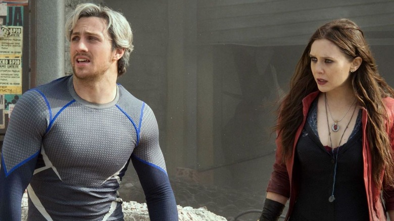 Wanda and Pietro standing amid ruins