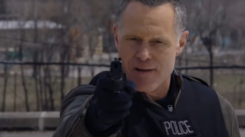 Hank Voight pointing gun