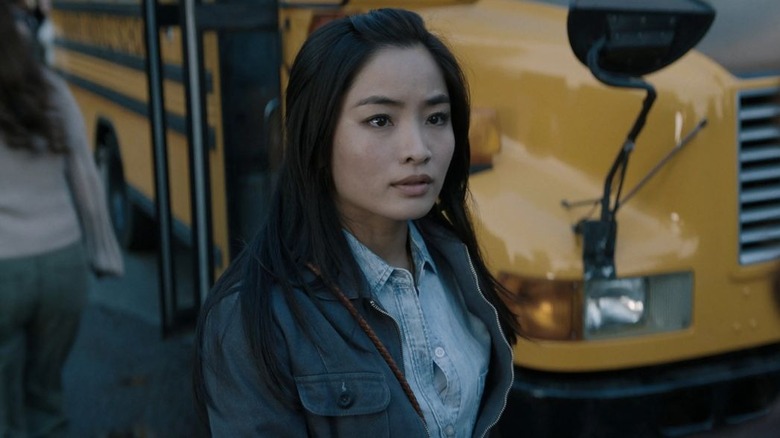 Keiko in front of a bus