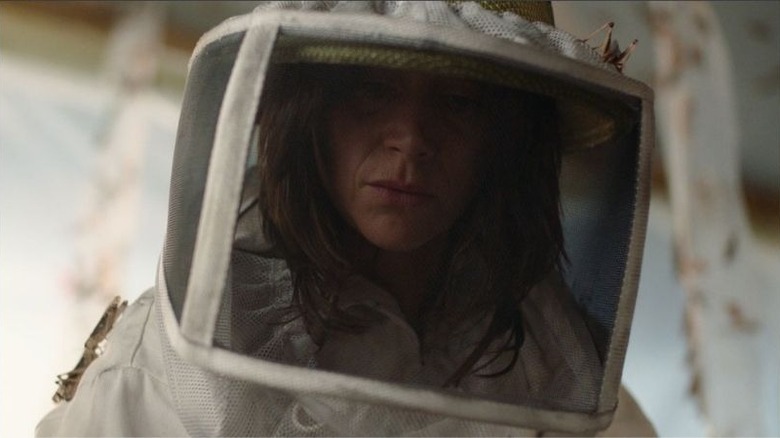 Dr. Roche in a beekeeper suit