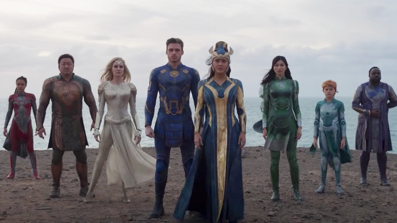 Eternals standing on beach