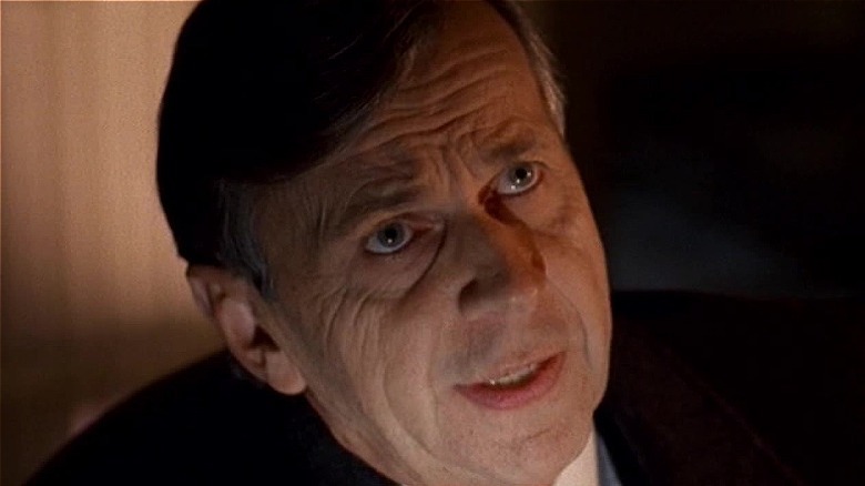 Cigarette Smoking Man at meeting