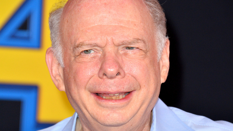 Wallace Shawn looking off camera