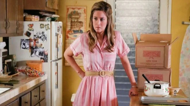 Angry Mary Cooper in pink dress