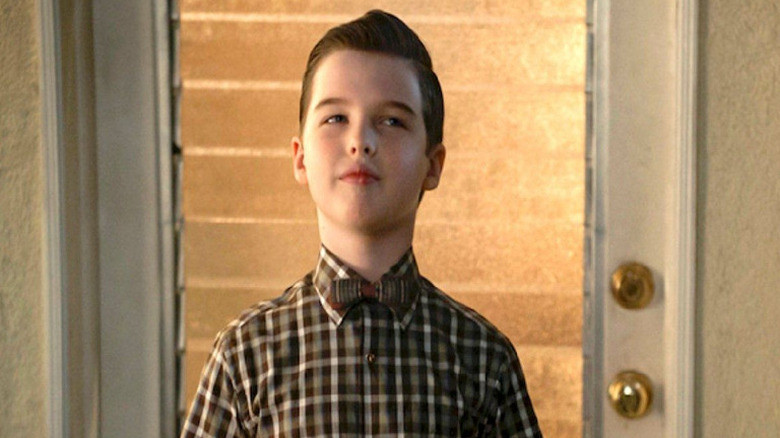 Young Sheldon Cooper smirking thoughtfully