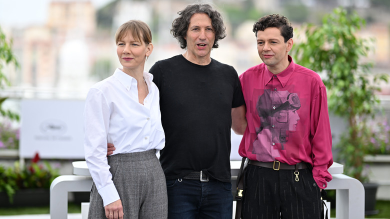 Sandra Hüller, Jonathan Glazer, and Christian Friedel on the red carpet