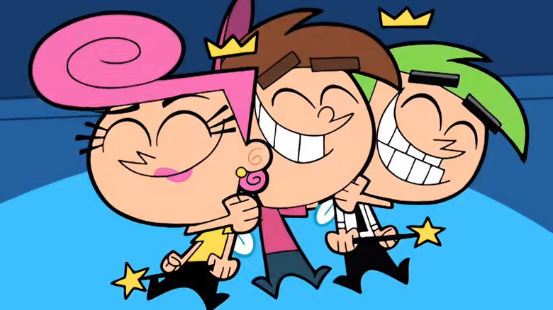 Timmy Turner hugging Wanda and Cosmo in "The Fairly Oddparents"