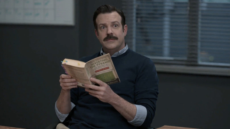 Ted reading Coach Beard's book