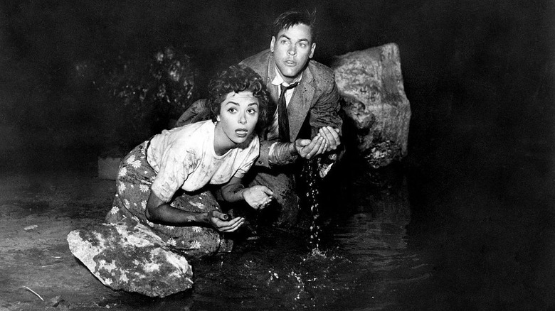 Miles and Becky hide from the pods in "Invasion of the Body Snatchers" (1956)