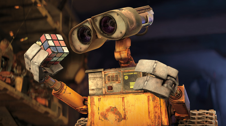 WALL-E studies a Rubik's Cube in "WALL-E" (2008)