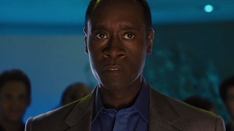 Rhodey looking wary