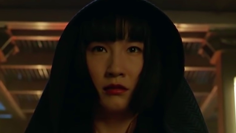 Xialing wearing a hood