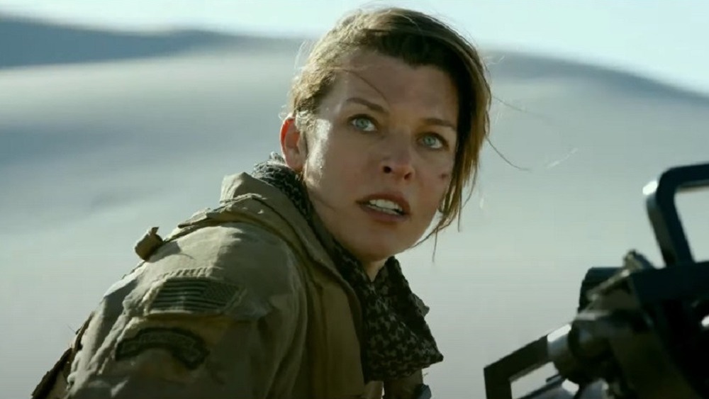 Milla Jovovich with gun