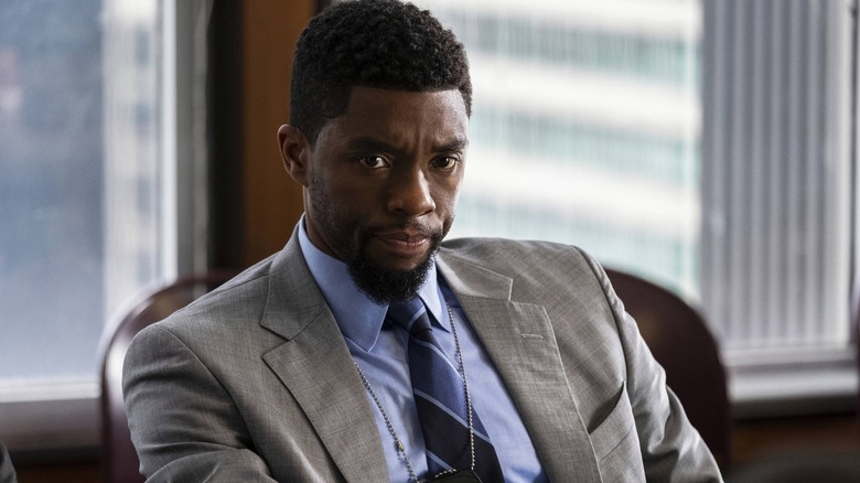 Detective Andre Davis sitting at his desk