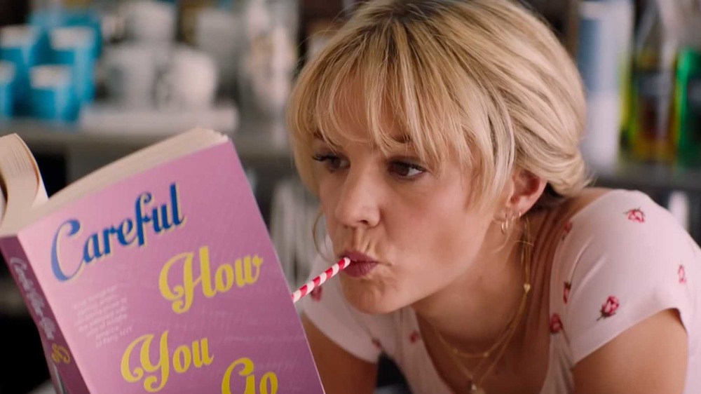 Carey Mulligan reads a book in Promising Young Woman