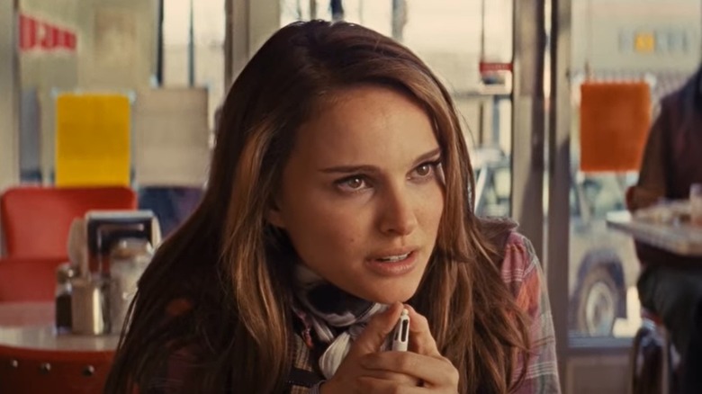 Natalie Portman listens intently