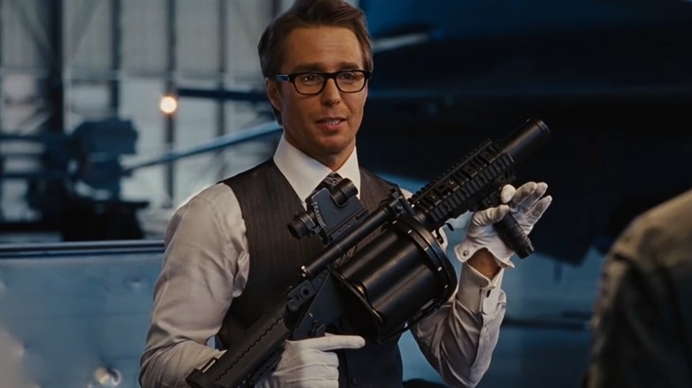 Sam Rockwell holds assault weapon