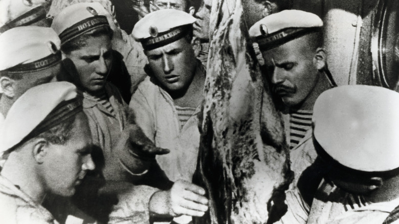 Battleship Potemkin sailors examine meat