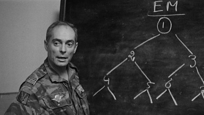 Colonel Philippe Mathieu and blackboard