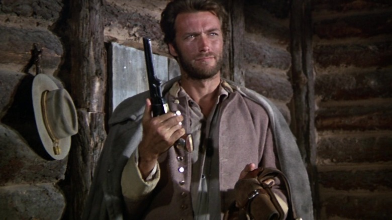 Clint Eastwood holds gun