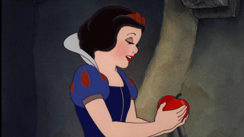 Snow White holding apple