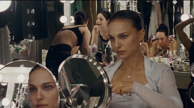 Nina looking at herself in the mirror