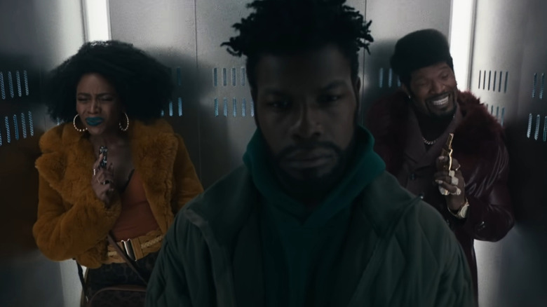 John Boyega, Jamie Foxx, Teyonah Parris in elevator