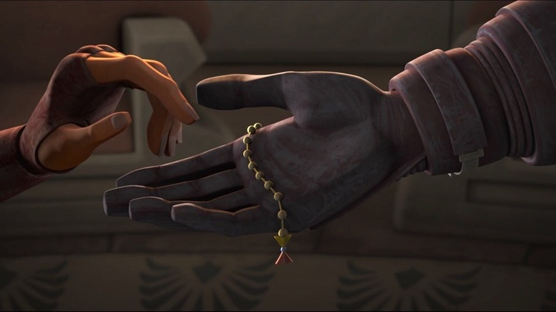 Ahsoka hands Anakin her beads