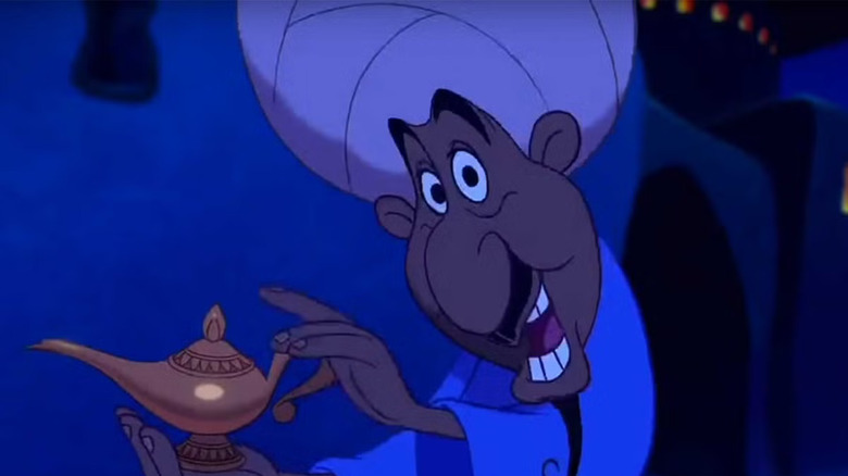 Aladdin opening scene showing merchant with lamp