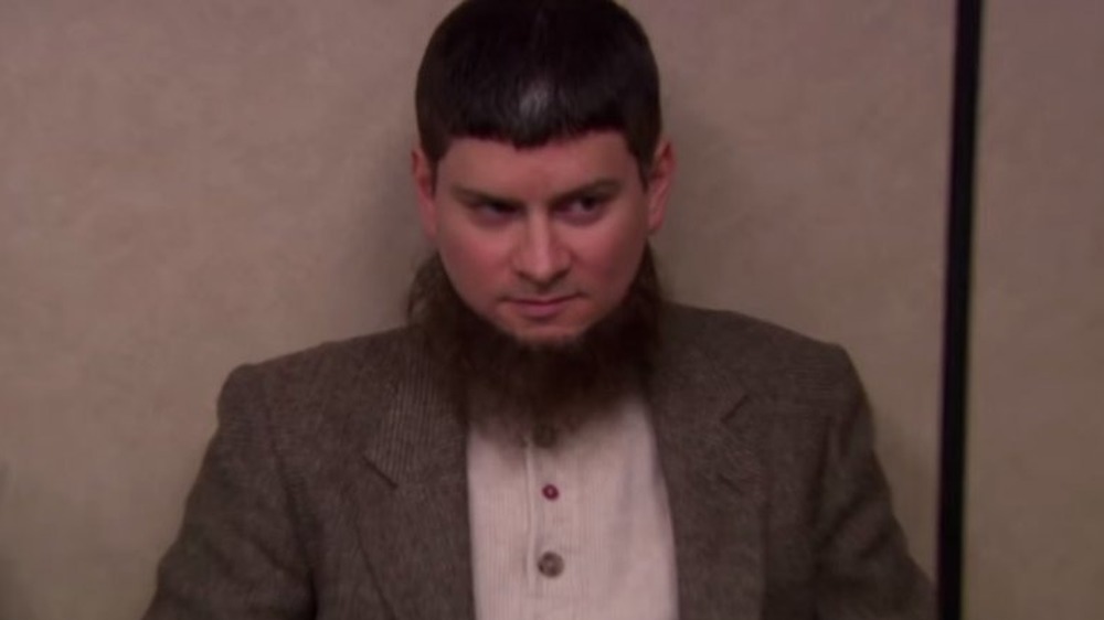 Mose Schrute wearing brown suit