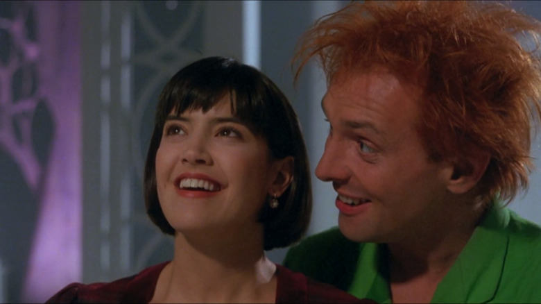 Lizzie Cronin smiles as Drop Dead Fred stands behind her