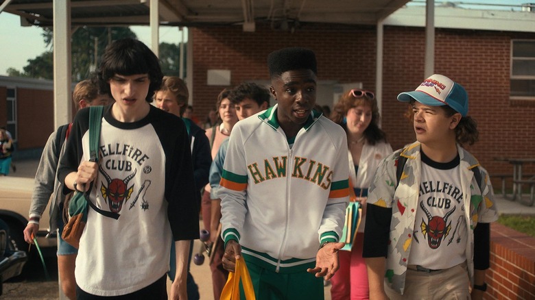 Mike, Lucas and Dustin walking at Hawkins High