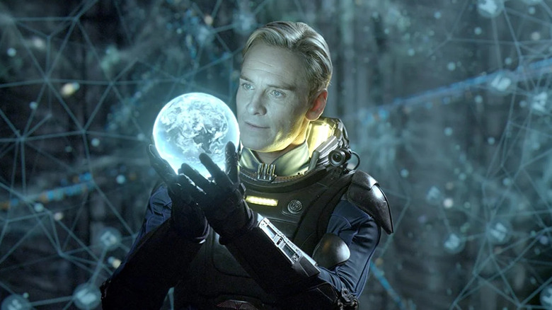 Michael Fassbender staring into orb