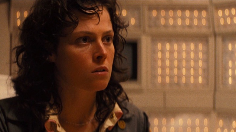Sigourney Weaver shocked looks off to side